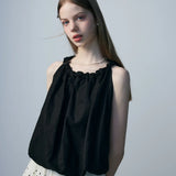 Women's Sleeveless Top with Ruffled Neckline and Bow Accent