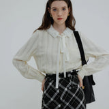 Ruffled Collar Blouse with Tie Neck and Textured Fabric