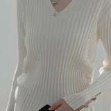 Chic Ribbed V-Neck Sweater with Button Cuff Details