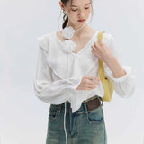 Romantic Ruffled Blouse with Floral Pin Accent