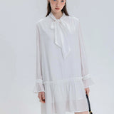 Flowy Tie-Neck Blouse with Ruffled Hem and Bishop Sleeves