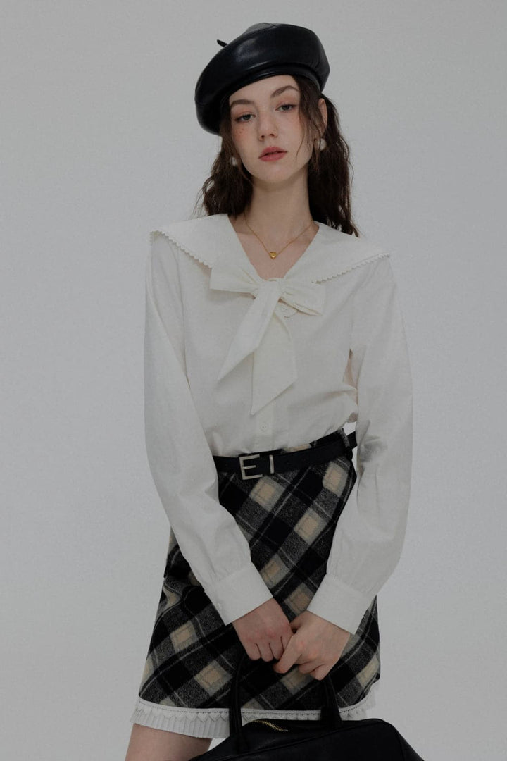 Elegant Blouse with Scalloped Collar and Front Tie Detail