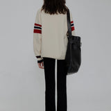Classic Collegiate Sweater with Striped Trim and Buttoned Placket