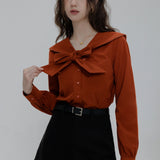 Elegant Blouse with Scalloped Collar and Front Tie Detail