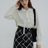Ruffled Collar Blouse with Tie Neck and Textured Fabric