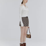 Chic Cut-Out Knit Top with Tie Detail – A Fresh Take on Casual Elegance