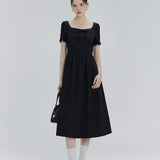 Elegant Short-Sleeve Dress with Decorative Neckline and Bow Detail