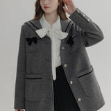 Ivory Wool Coat with Black Bow Details and Contrast Trim - Elegant Winter Wear
